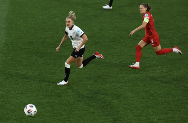 Germany's Janina Minge in action with Poland's Ewa Pajor
