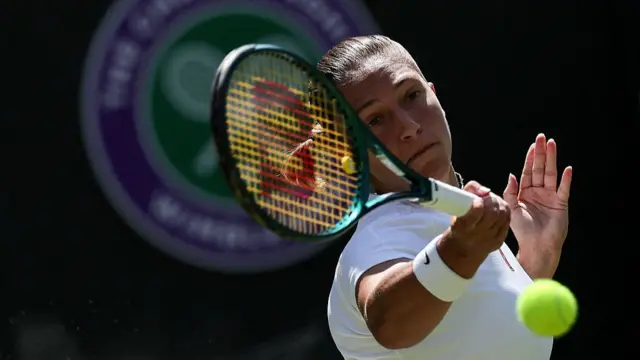 Diane Parry plays a forehand return