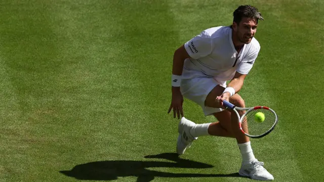 Britain's Cameron Norrie plays a forehand return