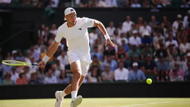 Jan-Lennard Struff plays a forehand return
