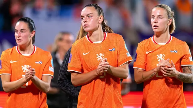 Dutch players applaud their fans