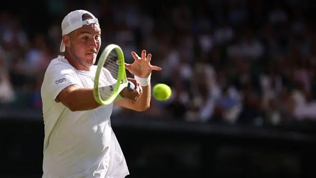 Jan-Lennard Struff plays a forehand return