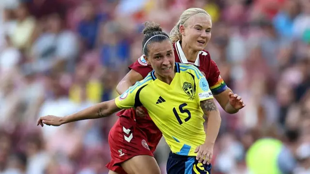 Julia Zigiotti Olme of Sweden is challenged by Pernille Harder of Denmark during the UEFA Women's EURO 2025 Group C match between Denmark and Sweden at Stade de Geneve