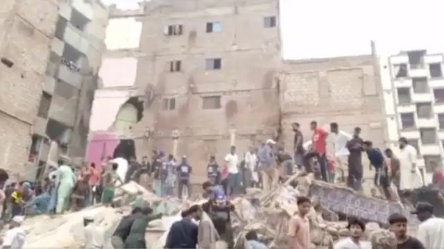 A screengrab from one video showing people trying to free those from the rubble