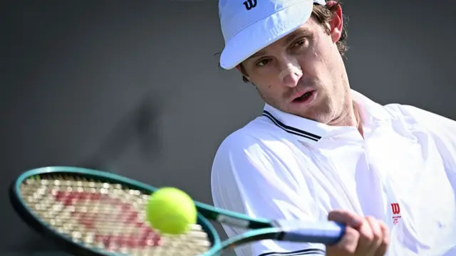 Nicolas Jarry plays a forehand return