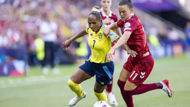 Sweden's Madelen Janogy (L) and Denmark's Katrine Veje in action during the UEFA Women's EURO 2025 group stage soccer match of Denmark against Sweden, in Geneva