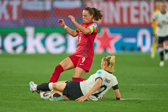 Sarai Linder of Team Germany battles for the ball with Ewa Pajor