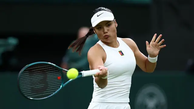 Emma Raducanu plays a forehand