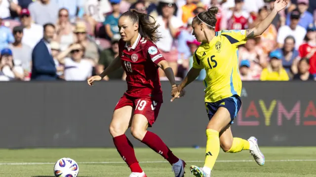 Denmark's Janni Thomsen (L) and Sweden's Julia Zigiotti Olme in action during the UEFA Women's EURO 2025 group stage soccer match of Denmark against Sweden