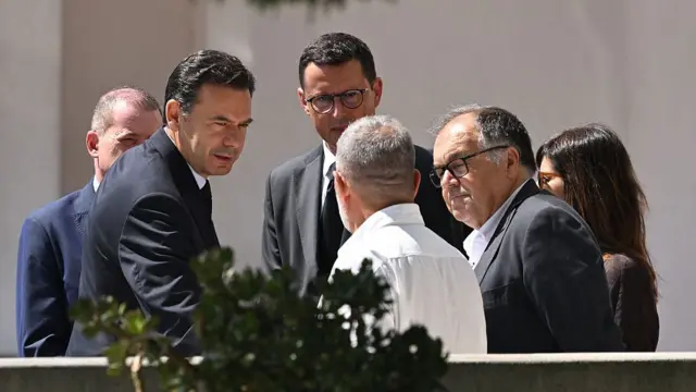 Portugal's prime minister  pictured speaking to others gathered at the wake