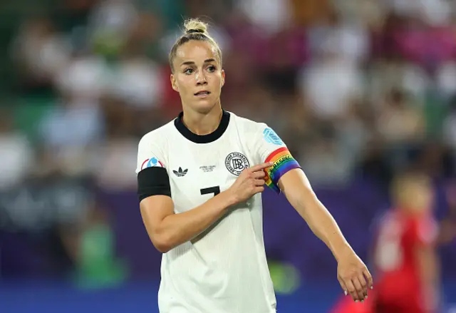Giulia Gwinn of Germany adjusts her rainbow coloured UEFA Respect captain's armband