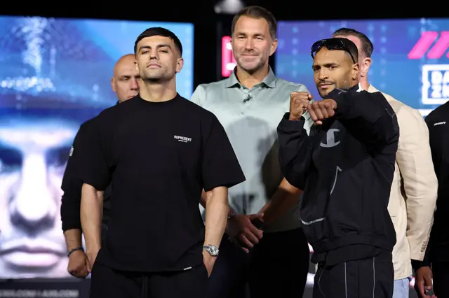 Jack Catterall stares ahead while Harlem Eubank sticks his fist out as they pose for pictures