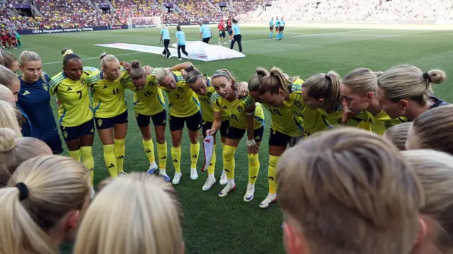 Players of Sweden huddle prior to the UEFA Women's EURO 2025 Group C match between Denmark and Sweden