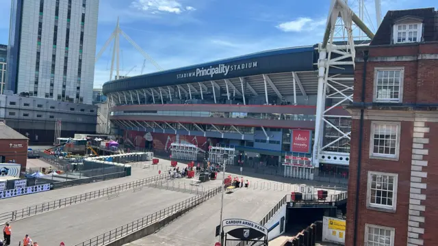 Photo of the main entrance of the Principality stadium in Cardiff. The blue skies can be seen in the background. lue skies can be seen in the background.