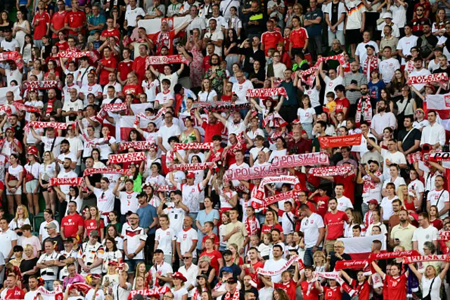 Fans of Poland cheer on their team