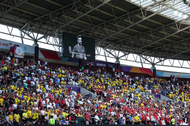 Fans of Sweden and Denmark play a moment's respect for Diogo Jota