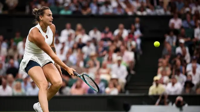 Aryna Sabalenka plays a forehand return