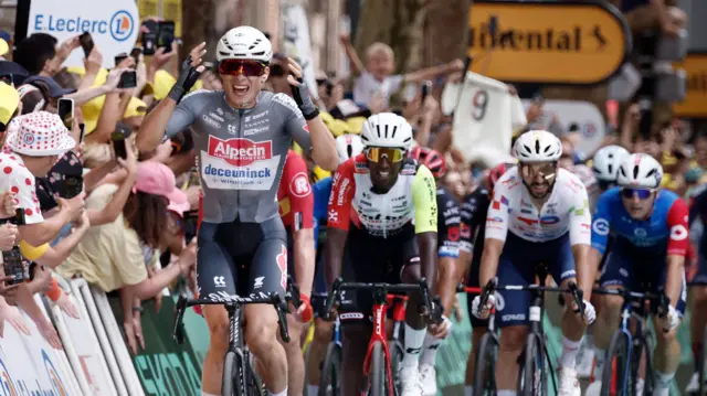 Jasper Philipsen celebrates winning stage one of the 2025 Tour de France