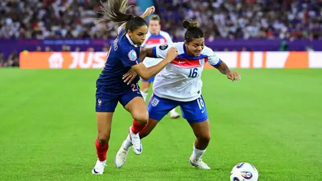 Delphine Cascarino of France, Jessica Carter of England during the EC Group D match between France and England