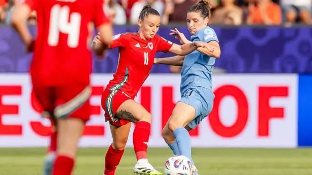 Hannah Cain of Wales Women, Dominique Janssen of Holland Women during the EURO Women match between Wales Women v Holland Women at the Allmend Stadium