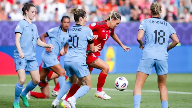 Dominique Janssen of the Netherlands battles for the ball with Gemma Evans of Wales during the UEFA Women's EURO 2025 Group D match between Wales and Netherlands at Luzern Arena
