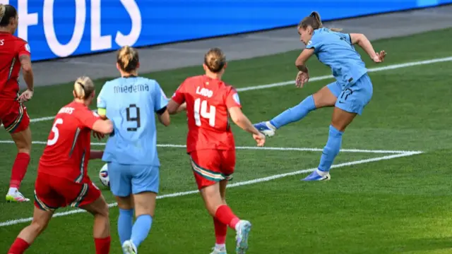 Netherlands' Victoria Pelova scores their second goal past Wales' Olivia Clark