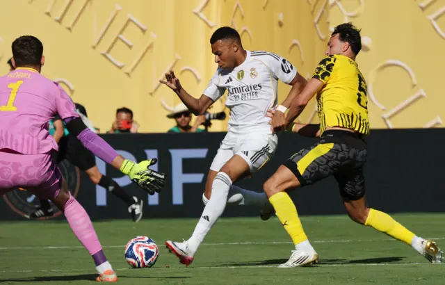 Kylian Mbappe's shot is saved by Gregor Kobel