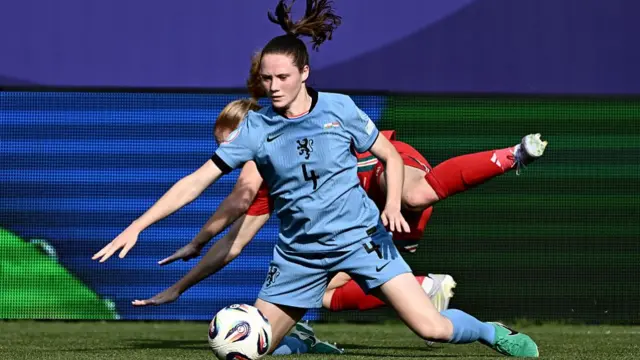 Netherlands' defender #04 Veerle Buurman fights for the ball during the UEFA Women's Euro 2025 Group D football match between Wales and The Netherlands at the Allmend Stadion Luzern in Lucerne