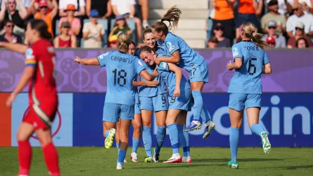 Vivianne Miedema of the Netherlands celebrates scoring her team's first goal with teammates, marking her 100th goal for the Netherlands, during the UEFA Women's EURO 2025 Group D match between Wales and Netherlands at Luzern Arena