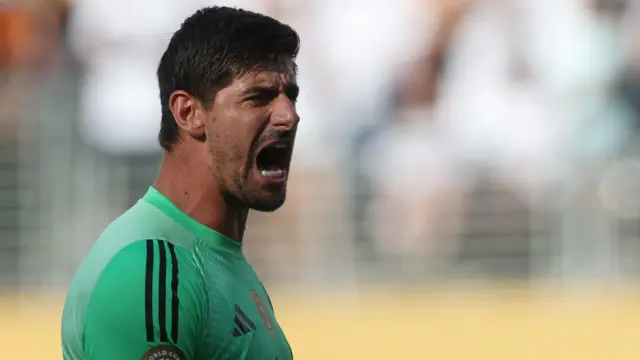 Thibaut Courtois celebrates his last minute save