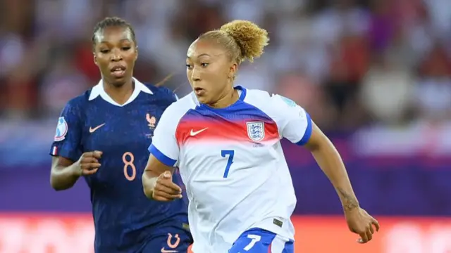 Lauren James of England is put under pressure by Grace Geyoro of France during the UEFA Women's EURO 2025 Group D match between France and England