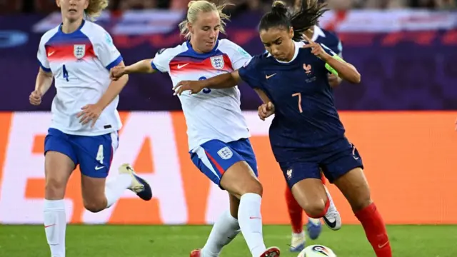 England's forward #09 Beth Mead fights for the ball with France's midfielder #07 Sakina Karchaoui during the UEFA Women's Euro 2025 Group D football match between France and England