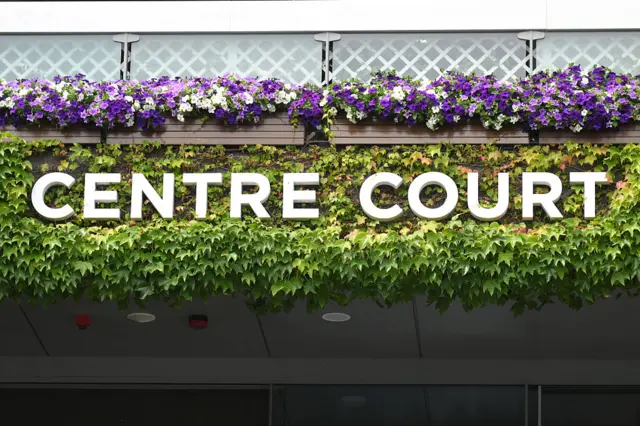 A Centre Court sign on greenery at Wimbledon