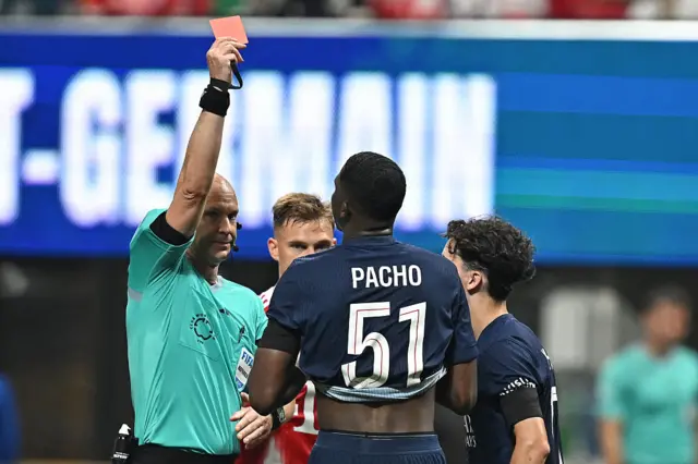 Anthony Taylor shows Willian Pacho a red card