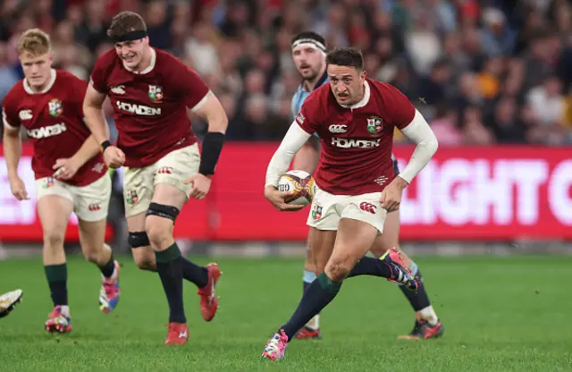 Alex Mitchell of the British & Irish Lions breaks with the ball