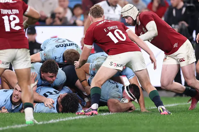 Ethan Dobbins of the Waratahs scores a try