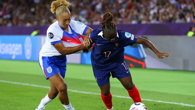 Lauren James of England battles for possession with Sandy Baltimore of France during the UEFA Womens EURO 2025 Group D match between France and England at Stadion Letzigrund