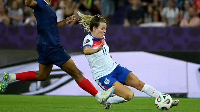 France's defender #04 Alice Sombath and England's forward #11 Lauren Hemp fight for the ball during the UEFA Women's Euro 2025 Group D football match between France and England