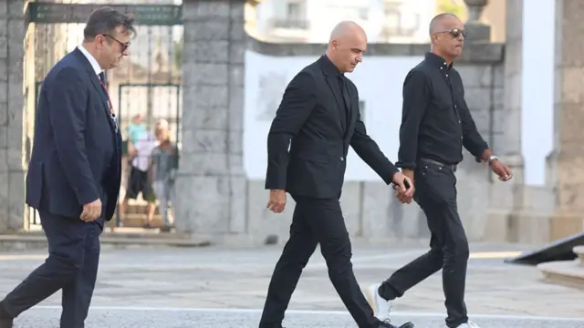Roberto Martinez arrives dressed in black