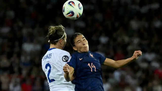 England's defender #02 Lucy Bronze and France's forward #14 Clara Mateo fight for the ball during the UEFA Women's Euro 2025 Group D football match between France and England at the Letzigrund Stadium in Zurich