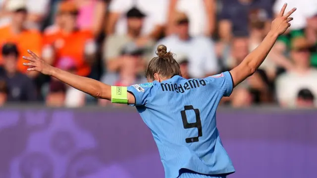 Vivianne Miedema of the Netherlands celebrates scoring her team's first goal, marking her 100th goal for the Netherlands, during the UEFA Women's EURO 2025 Group D match between Wales and Netherlands at Luzern Arena