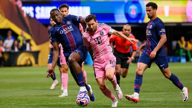 Lionel Messi of Inter Miami CF is chased by Willian Pacho of Paris Saint-Germain