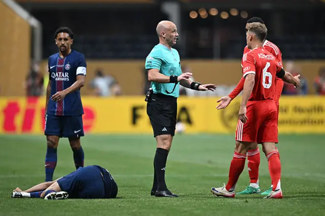 Hakimi is down injured after being tackled by Stanisic
