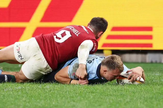 Darby Lancaster of the Waratahs scores