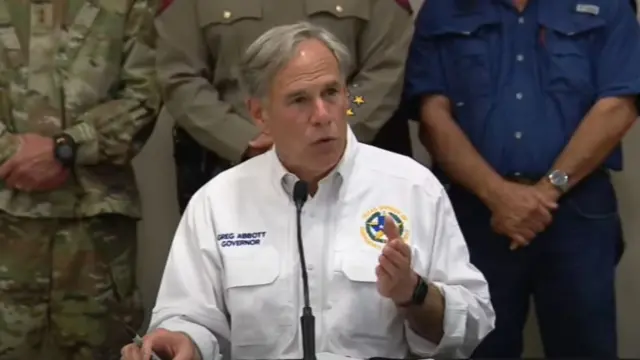 Governor Greg Abbott wearing a white shirt