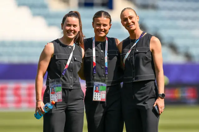 Esther Morgan, Hayley Ladd and Rhiannon Roberts on the pitch