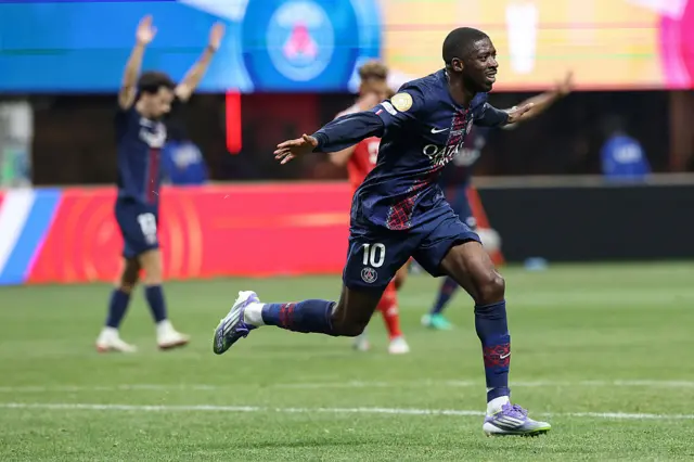 Ousmane Dembele celebrates after scoring for PSG
