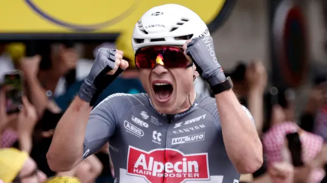Jasper Philipsen celebrates winning stage one of the 2025 Tour de France