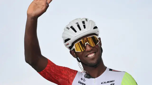 Biniam Girmay waves to fans before the 2025 Tour de France
