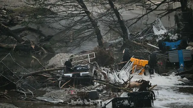 Overturned vehicles amid flood water in Texas